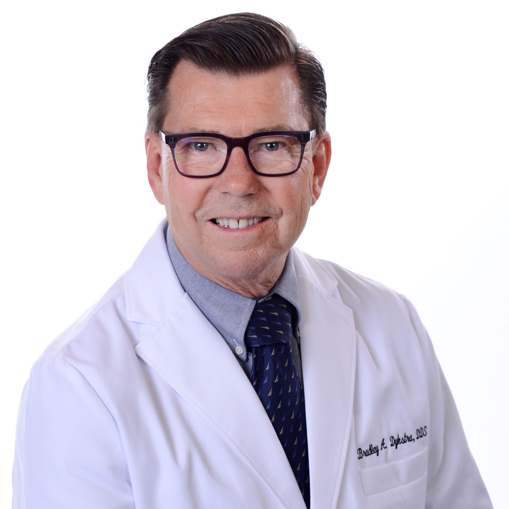 Portrait of Dr. Bradley Dykstra, Founder and CEO of MI Smiles Dental Group